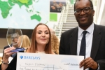 Kwasi Presents cheque to Shannon McBride of Magic Elephant Ltd