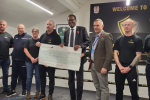 Kwasi and Councillor Darren Clarke presenting a cheque for £2000 to The Academy Boxing Club