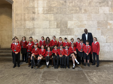 Kwasi with pupils from Springfield Primary School