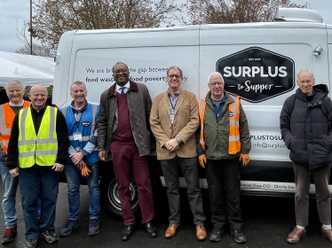 Kwasi with CEO Andrew Osbourne and Surplus to Supper volunteers 